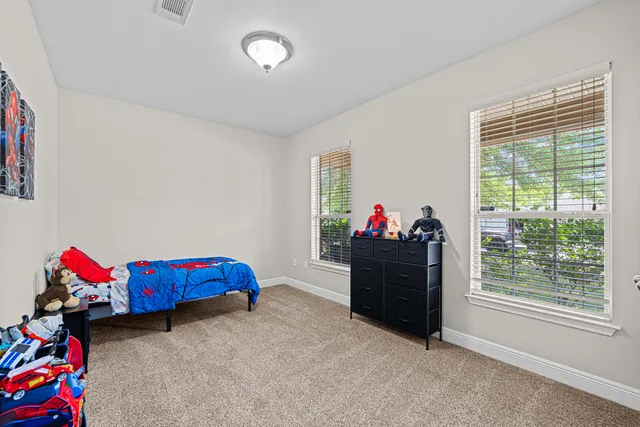 a bed room with a bed and a couch