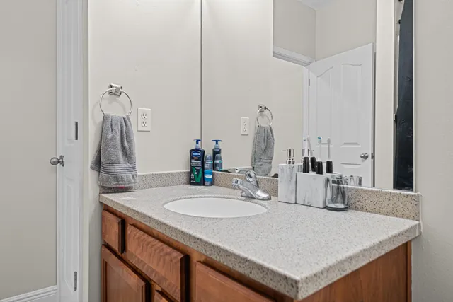 a bathroom with a sink and a mirror