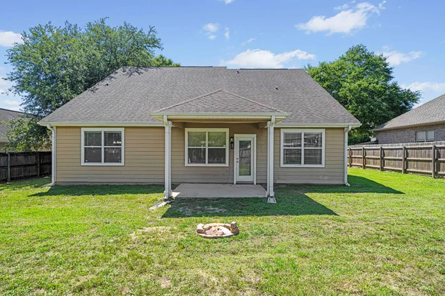 a front view of a house with a yard and porch