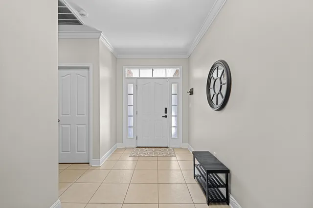 a view of a room with wooden floor and a window