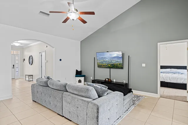 a living room with furniture and a flat screen tv
