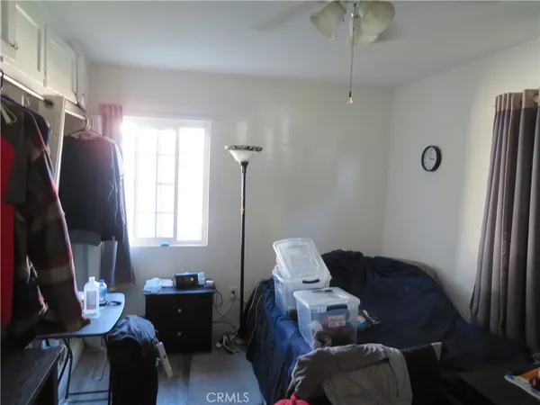 a living room with furniture chess board and a window