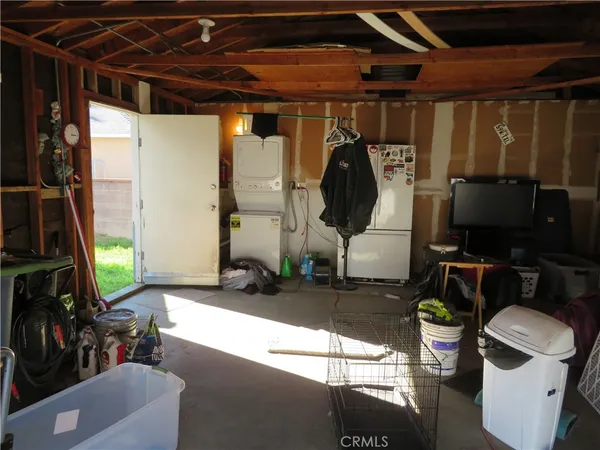 a view of living room with furniture and a flat screen tv