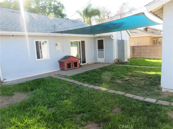 a view of a backyard of the house