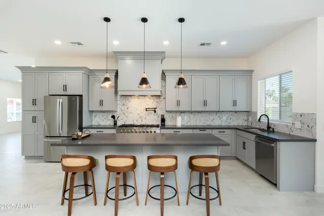 a kitchen with a table and chairs in it