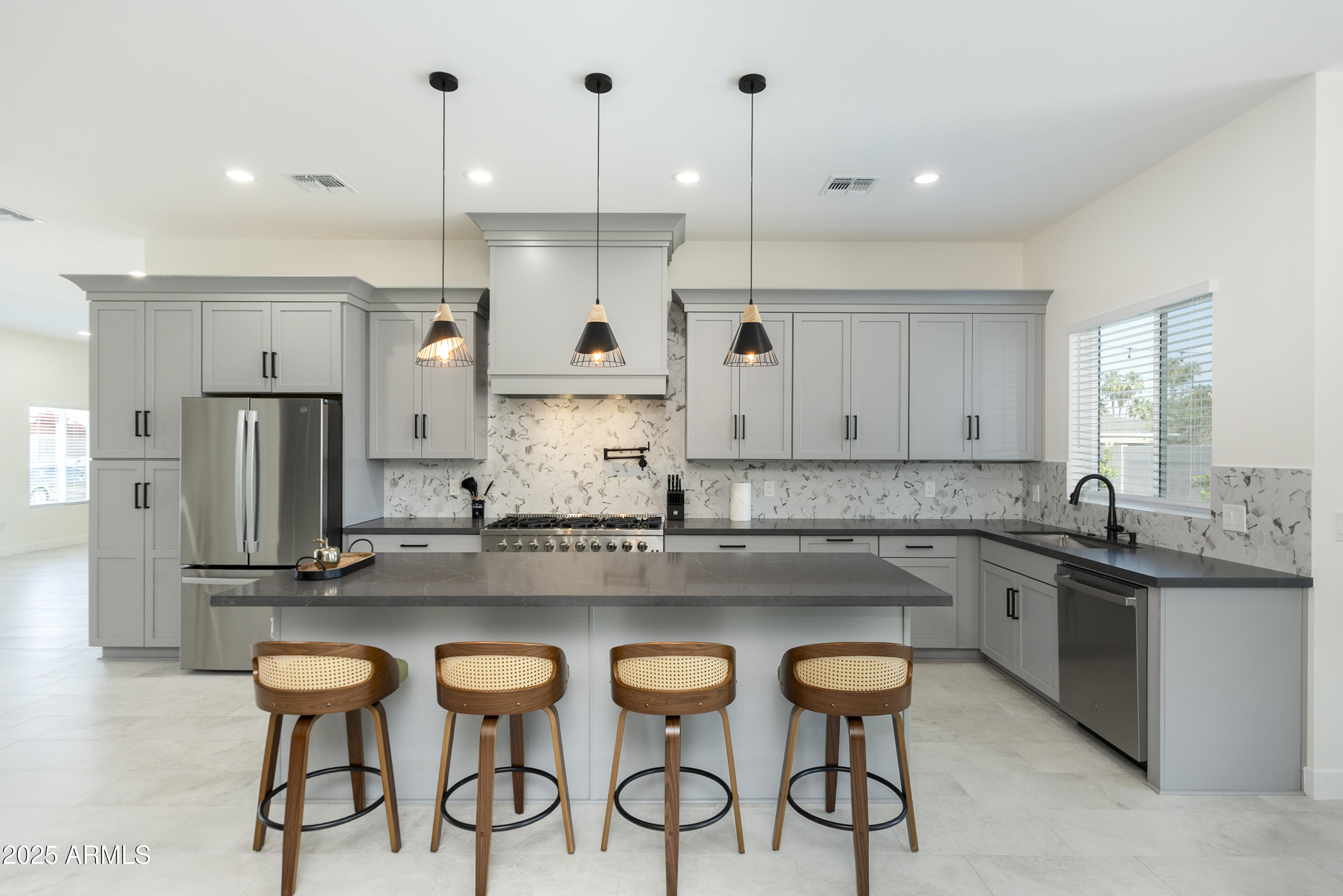 a kitchen with a table and chairs in it