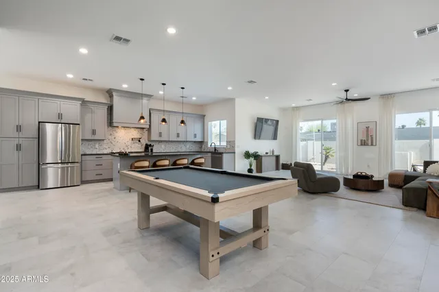 a spacious bathroom with a granite countertop sink mirror and shower