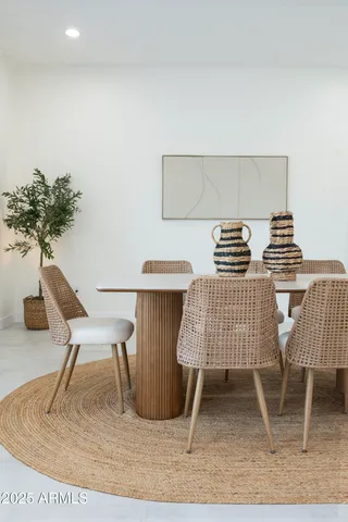 a bedroom with a bed and a mirror