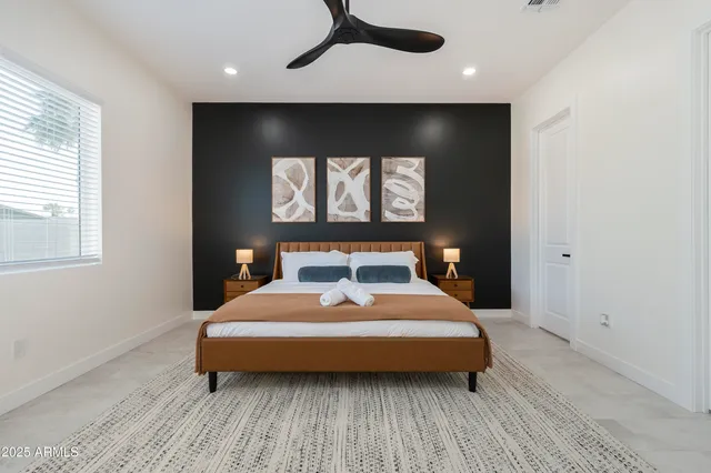 a bedroom with a bed and a window