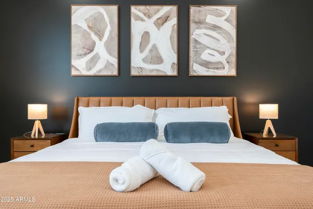 a bedroom with a bed and a mirror