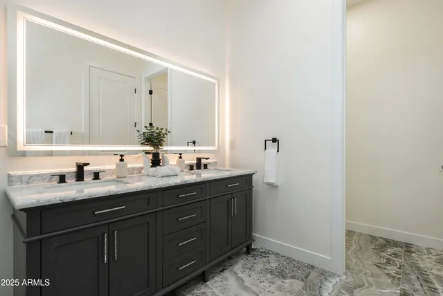 a kitchen with stainless steel appliances granite countertop a sink and cabinets