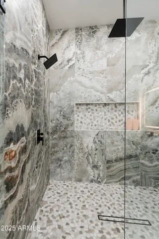 a bedroom with a bed and a painting on the wall