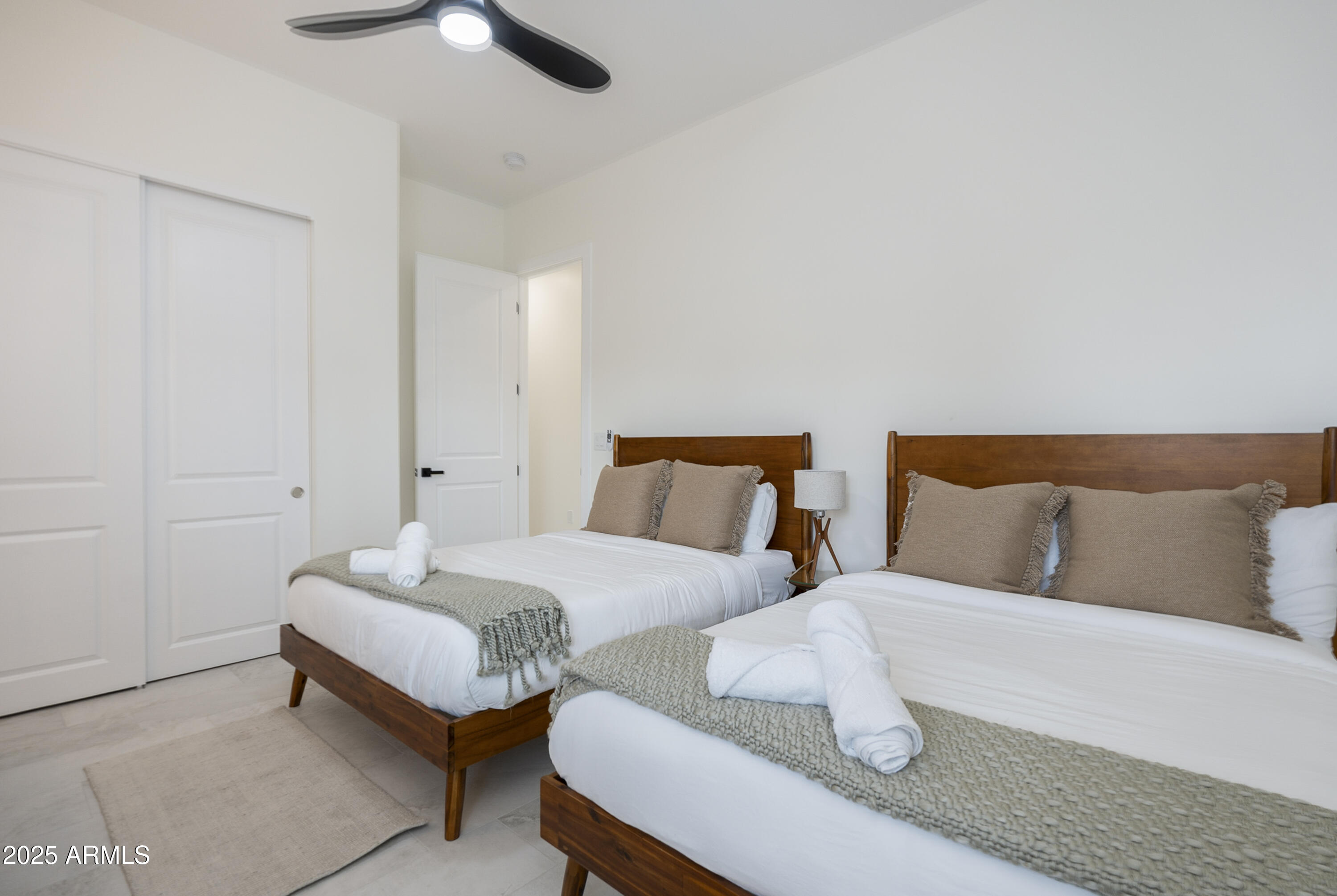 5049 East Shaw Butte Drive Scottsdale, AZ 85254 - Photo 5 of 88 a bedroom with two beds and painting on the wall