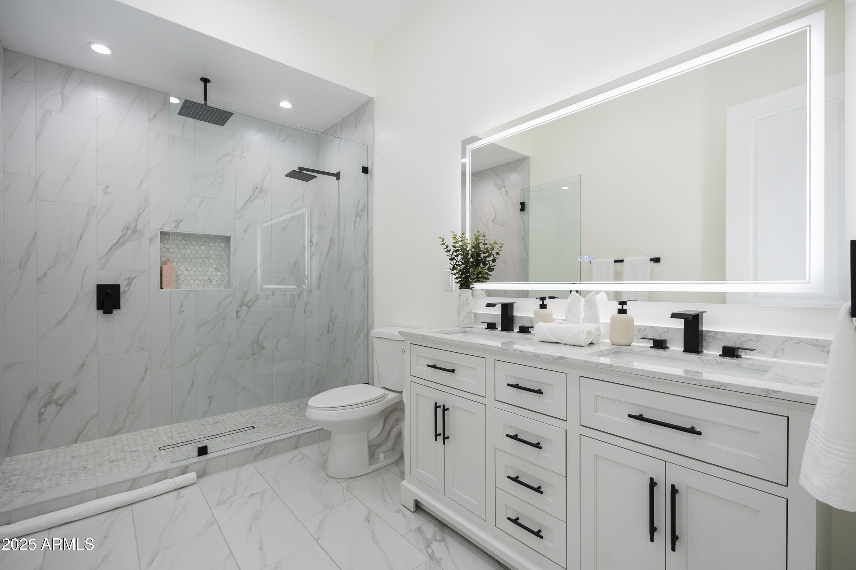 5049 East Shaw Butte Drive Scottsdale, AZ 85254 - Photo 57 of 88 a bathroom with a double vanity sink toilet mirror and shower