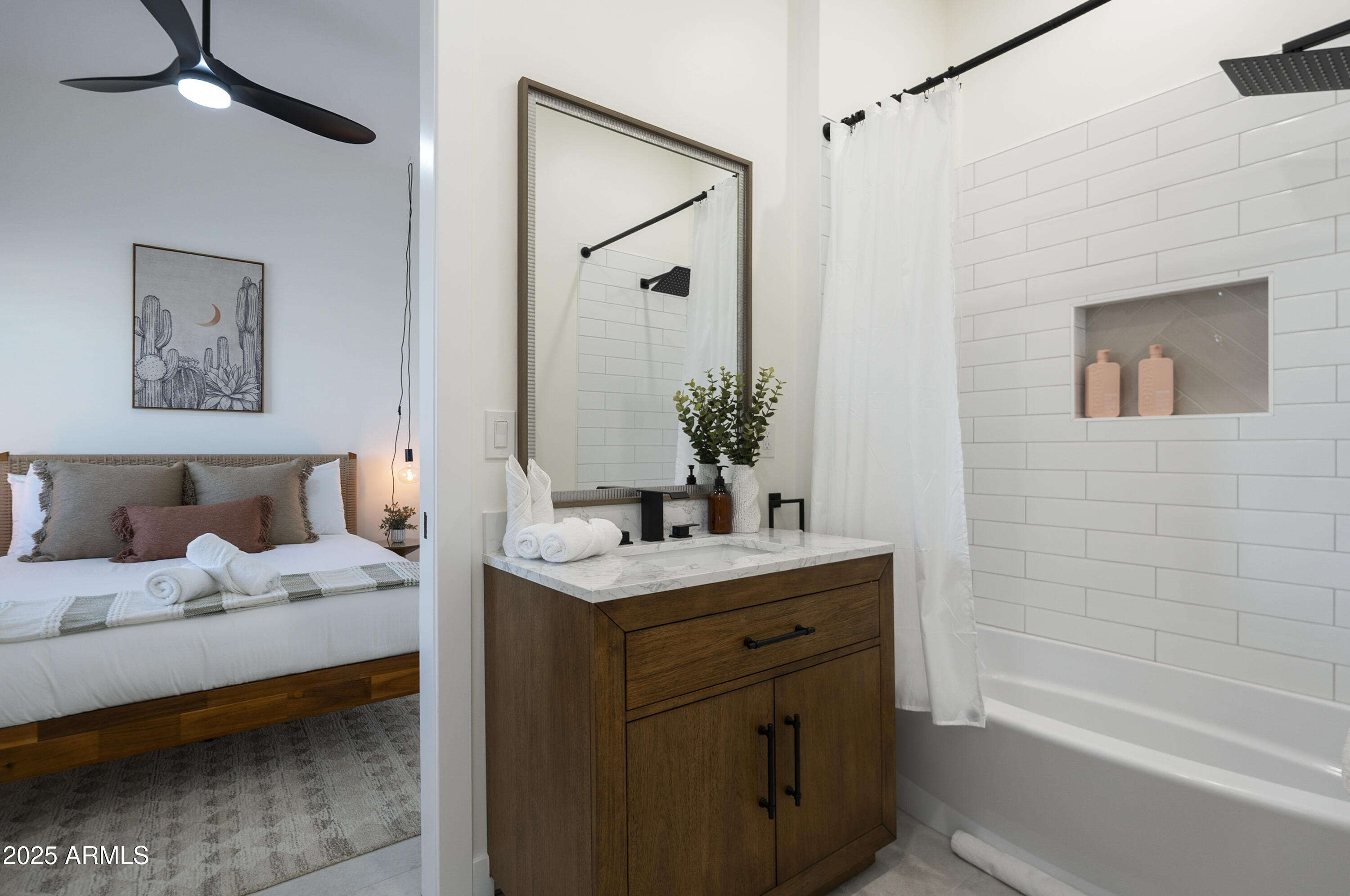 5049 East Shaw Butte Drive Scottsdale, AZ 85254 - Photo 60 of 88 a bathroom with a tub sink and mirror