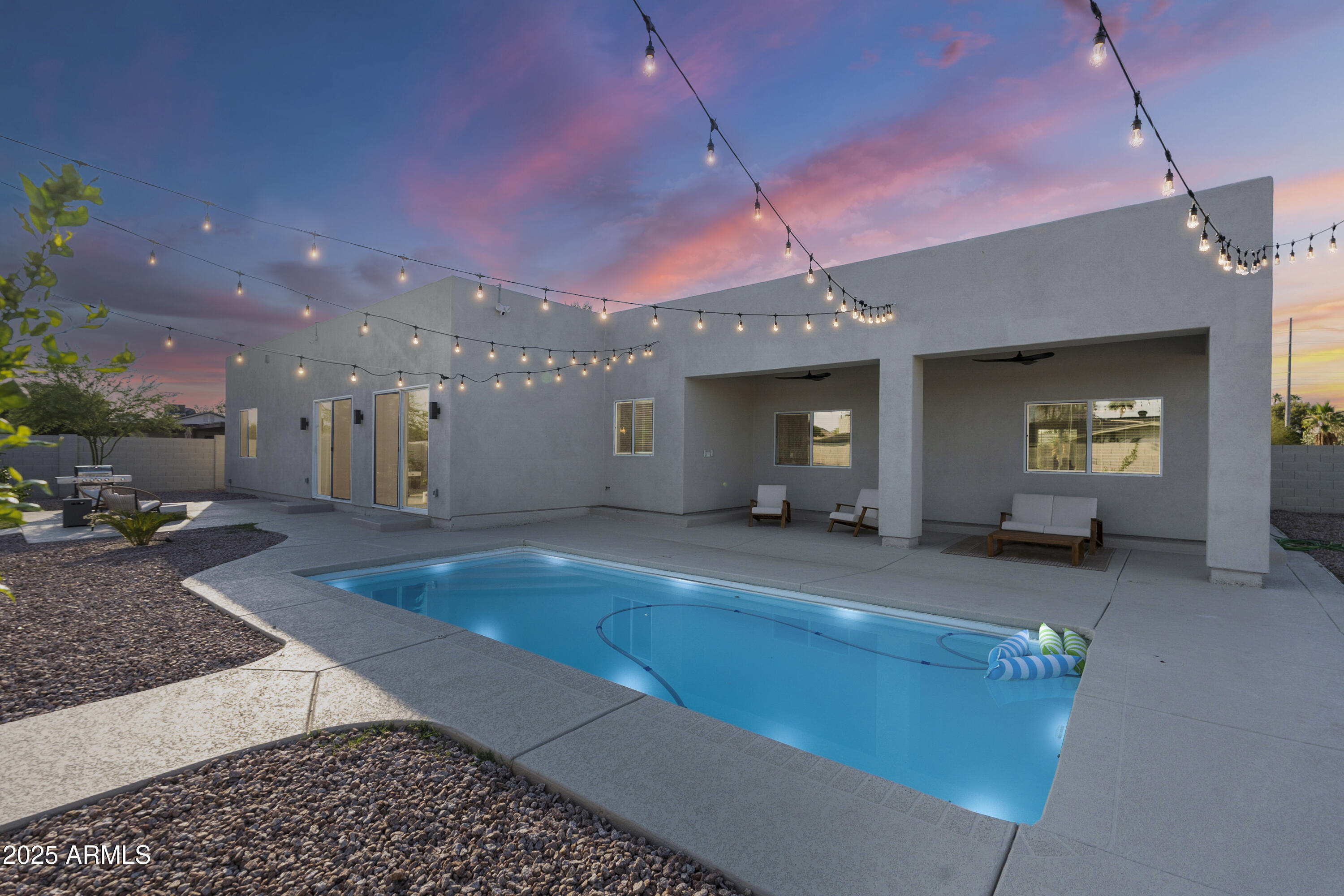 5049 East Shaw Butte Drive Scottsdale, AZ 85254 - Photo 87 of 88 a living room with furniture and a flat screen tv
