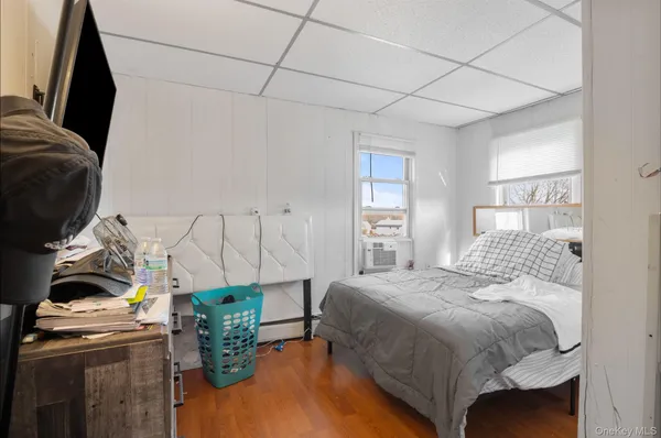 a bedroom with two beds and a chandelier