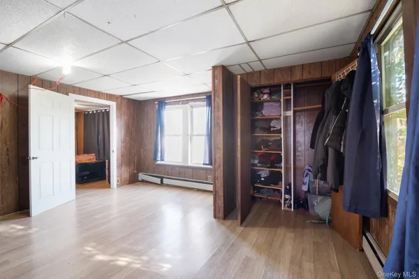 a living room with furniture and large windows