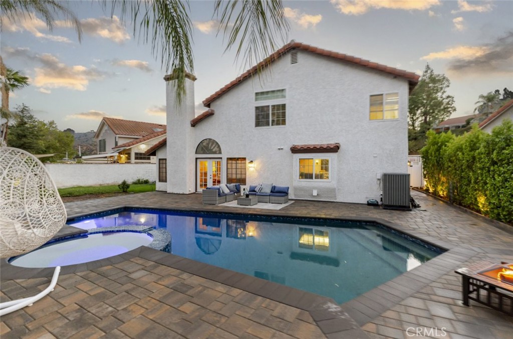25010 Foxtail Court Stevenson Ranch, CA 91381 - Photo 11 of 64 a view of a house with swimming pool and sitting area