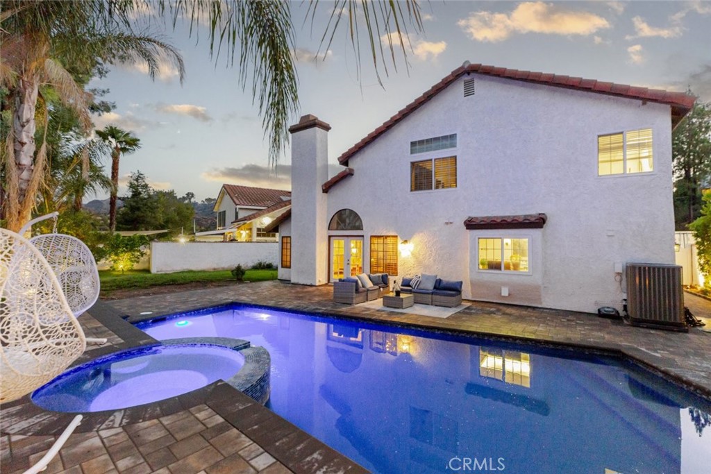 25010 Foxtail Court Stevenson Ranch, CA 91381 - Photo 2 of 64 a view of a house with swimming pool and sitting area
