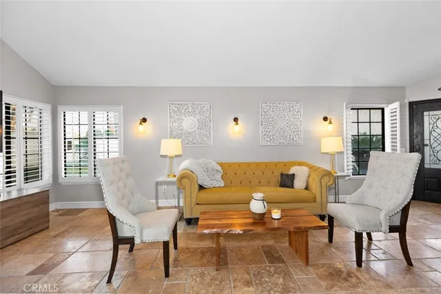 a large kitchen with stainless steel appliances granite countertop a stove a sink and a granite counter tops