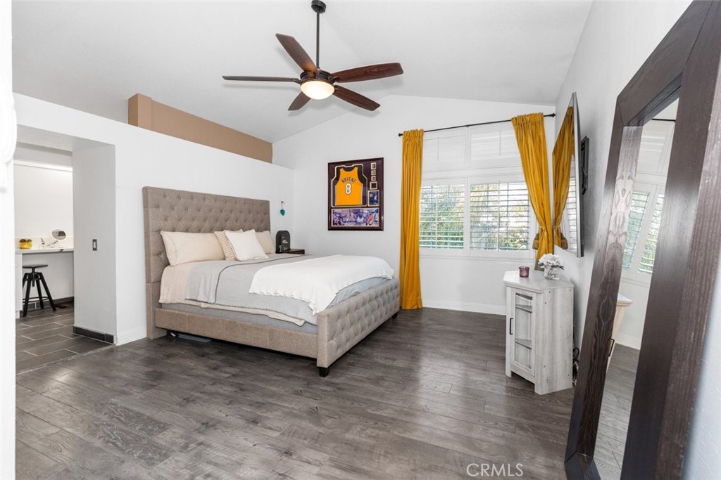 25010 Foxtail Court Stevenson Ranch, CA 91381 - Photo 37 of 64 a bedroom with a large bed and a chandelier