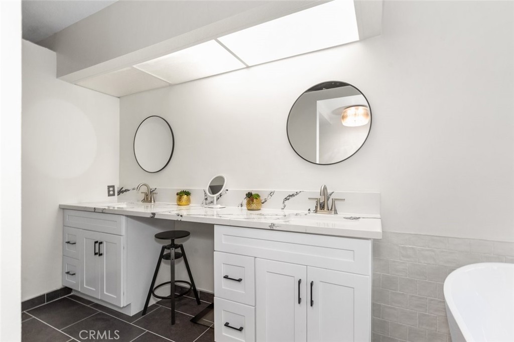 25010 Foxtail Court Stevenson Ranch, CA 91381 - Photo 41 of 64 a bathroom with a sink and a mirror