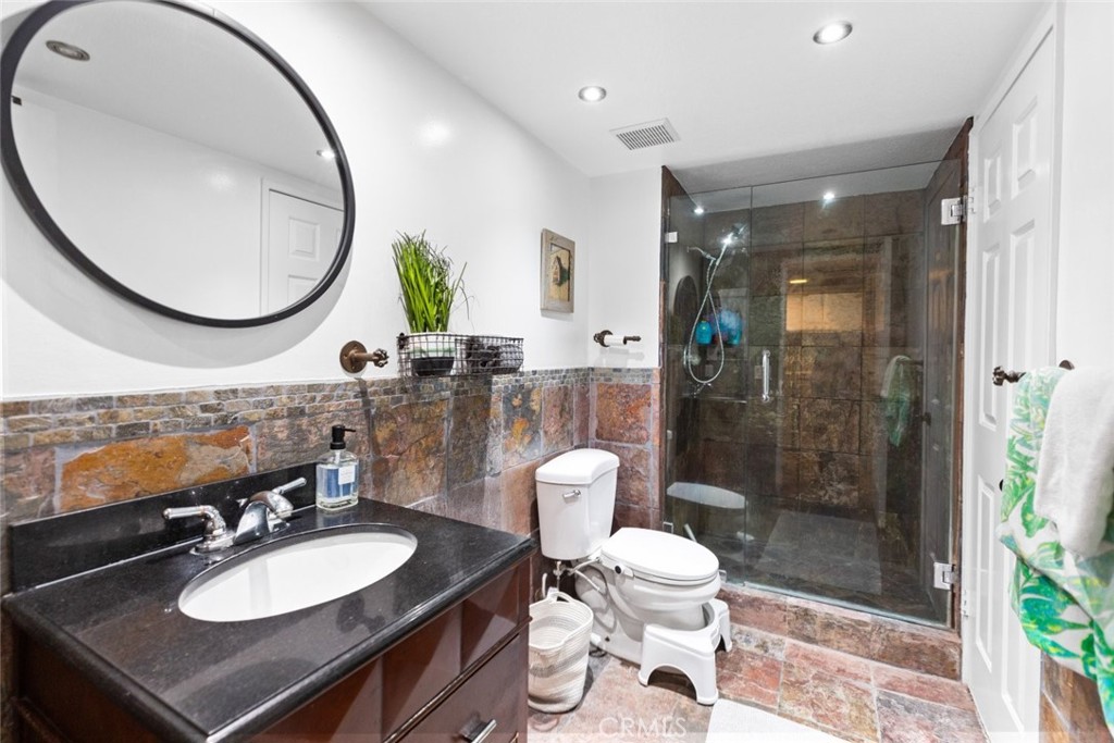 25010 Foxtail Court Stevenson Ranch, CA 91381 - Photo 48 of 64 a bathroom with a sink a toilet and a mirror