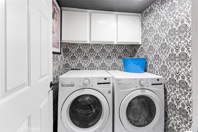 an aerial view of a house with a swimming pool a yard and lake view