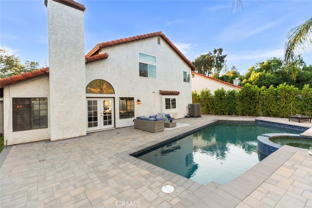 25010 Foxtail Court Stevenson Ranch, CA 91381 - Photo 56 of 64 a view of a house with pool and chairs