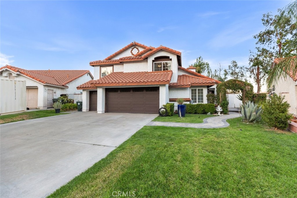 25010 Foxtail Court Stevenson Ranch, CA 91381 - Photo 59 of 64 a front view of a house with a yard and garage