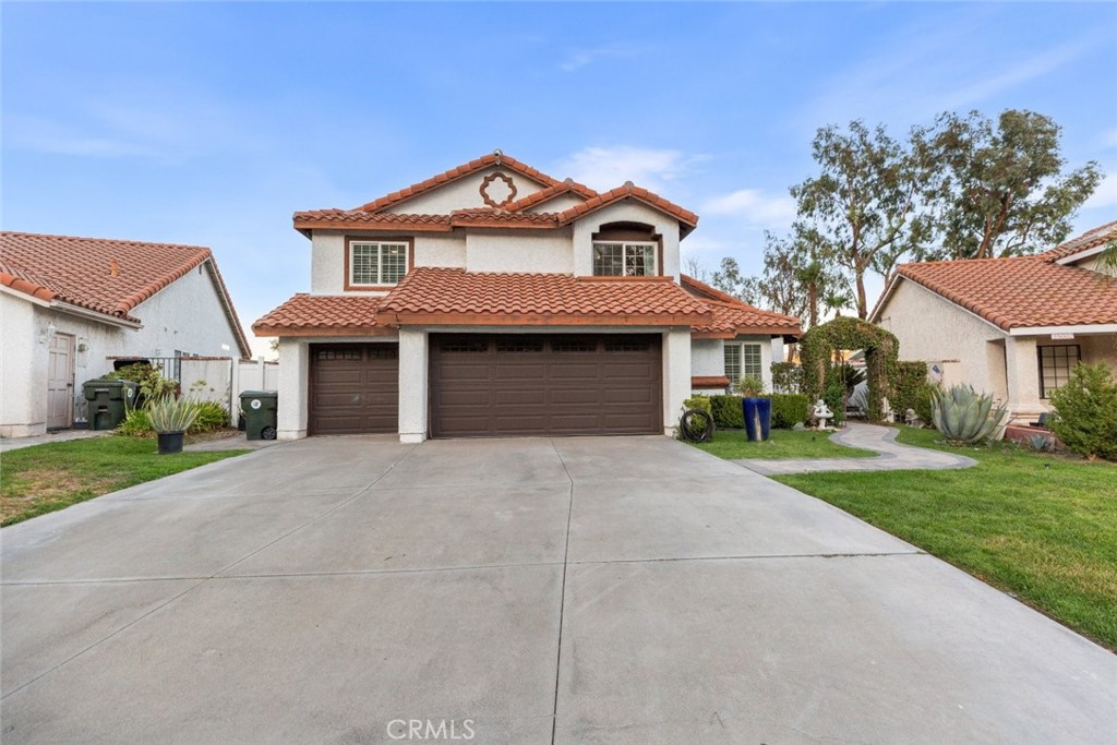 25010 Foxtail Court Stevenson Ranch, CA 91381 - Photo 60 of 64 a front view of a house with a yard and garage