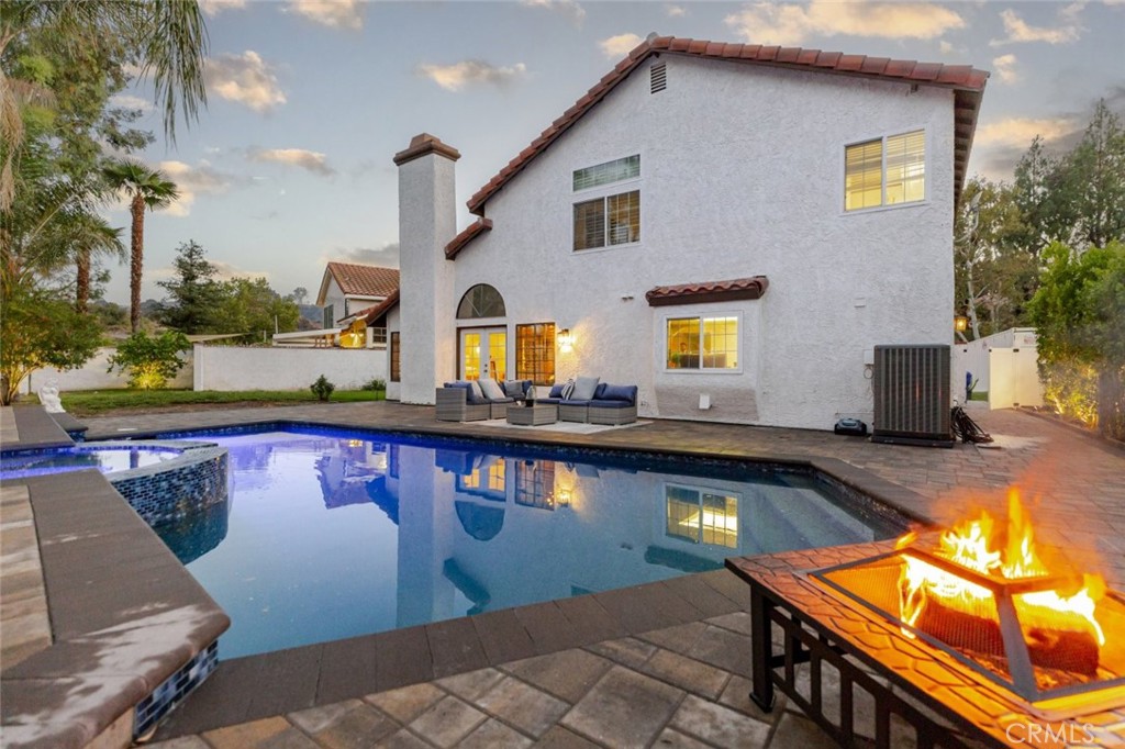 25010 Foxtail Court Stevenson Ranch, CA 91381 - Photo 10 of 64 a view of swimming pool with seating area and barbeque oven