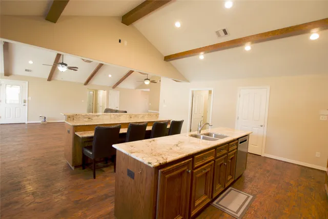 a kitchen with a sink and stove
