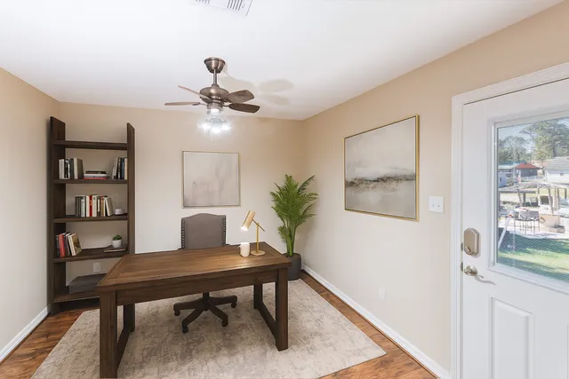 a workspace with furniture and a rug