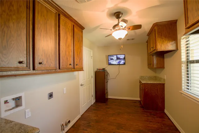 a view of an entryway with wooden floor