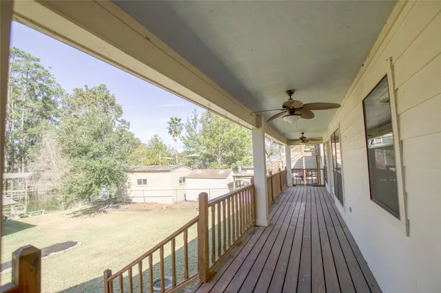 a view of a porch with wooden floor and outdoor space