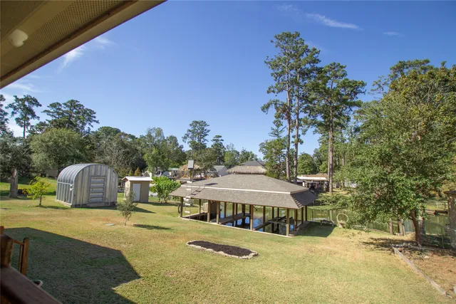a view of a house with swimming pool and sitting area