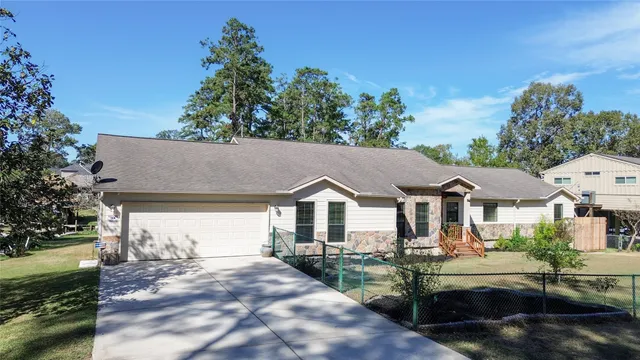 a view of house with outdoor space and sitting area