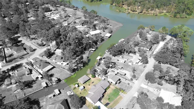 an aerial view of a house with a lake view