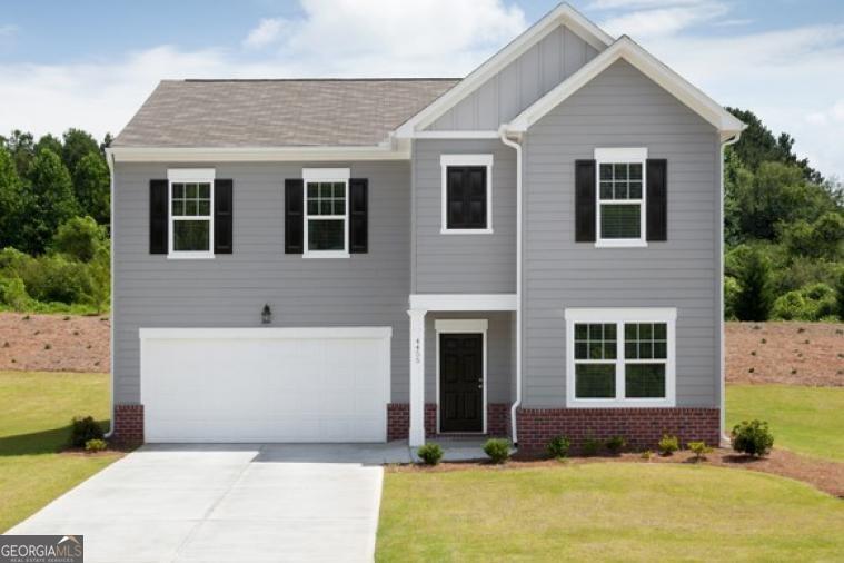 a front view of house with yard
