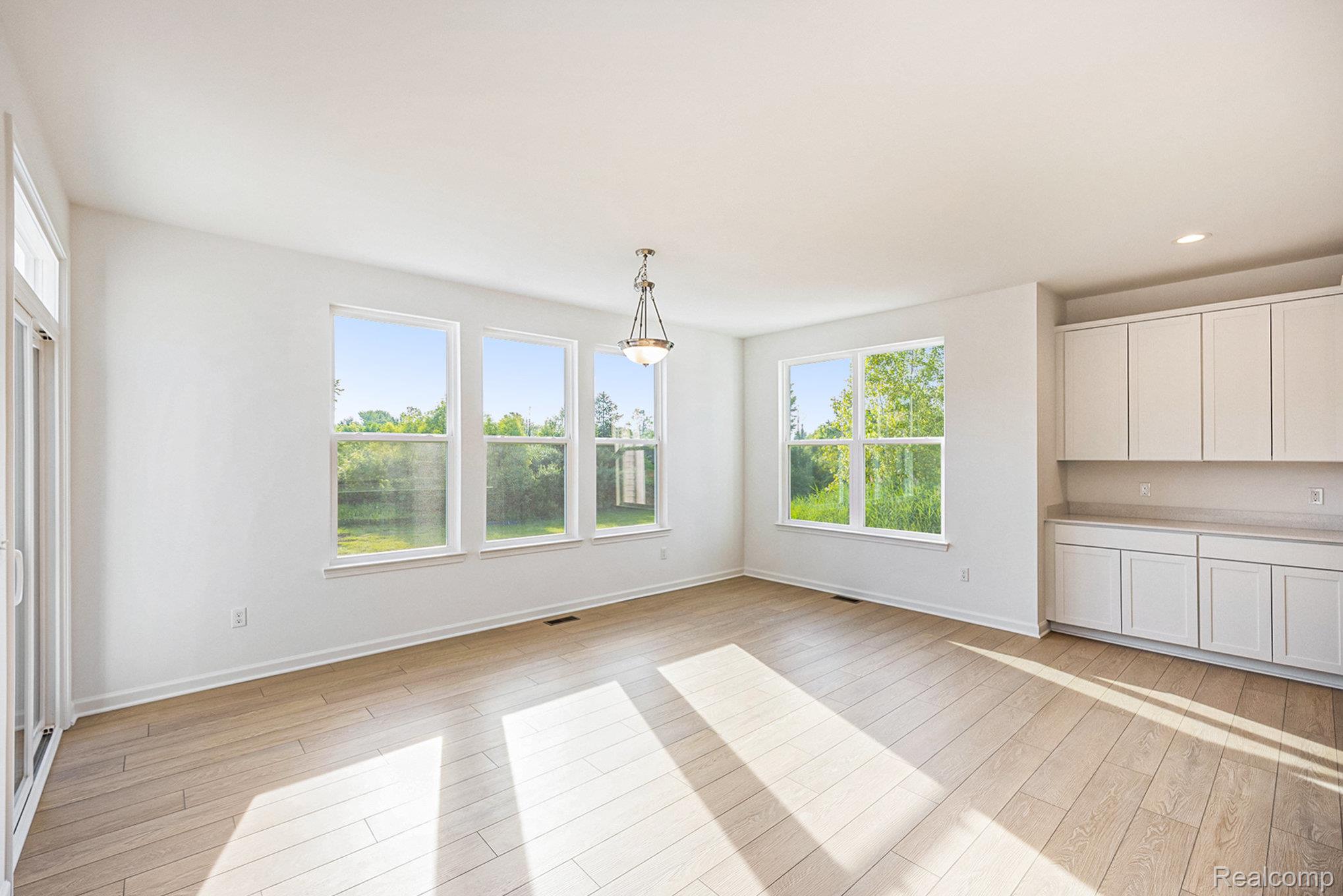 68788 Place Road New Haven, MI 48050 - Photo 5 of 29 Unfurnished dining area featuring light wood-style floors
