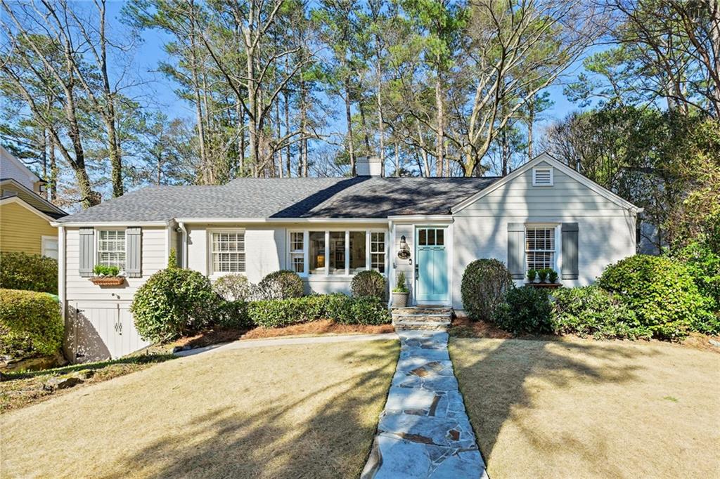 706 Darlington Road Northeast Atlanta, GA 30305 - Photo 1 of 1 a front view of a house with a yard