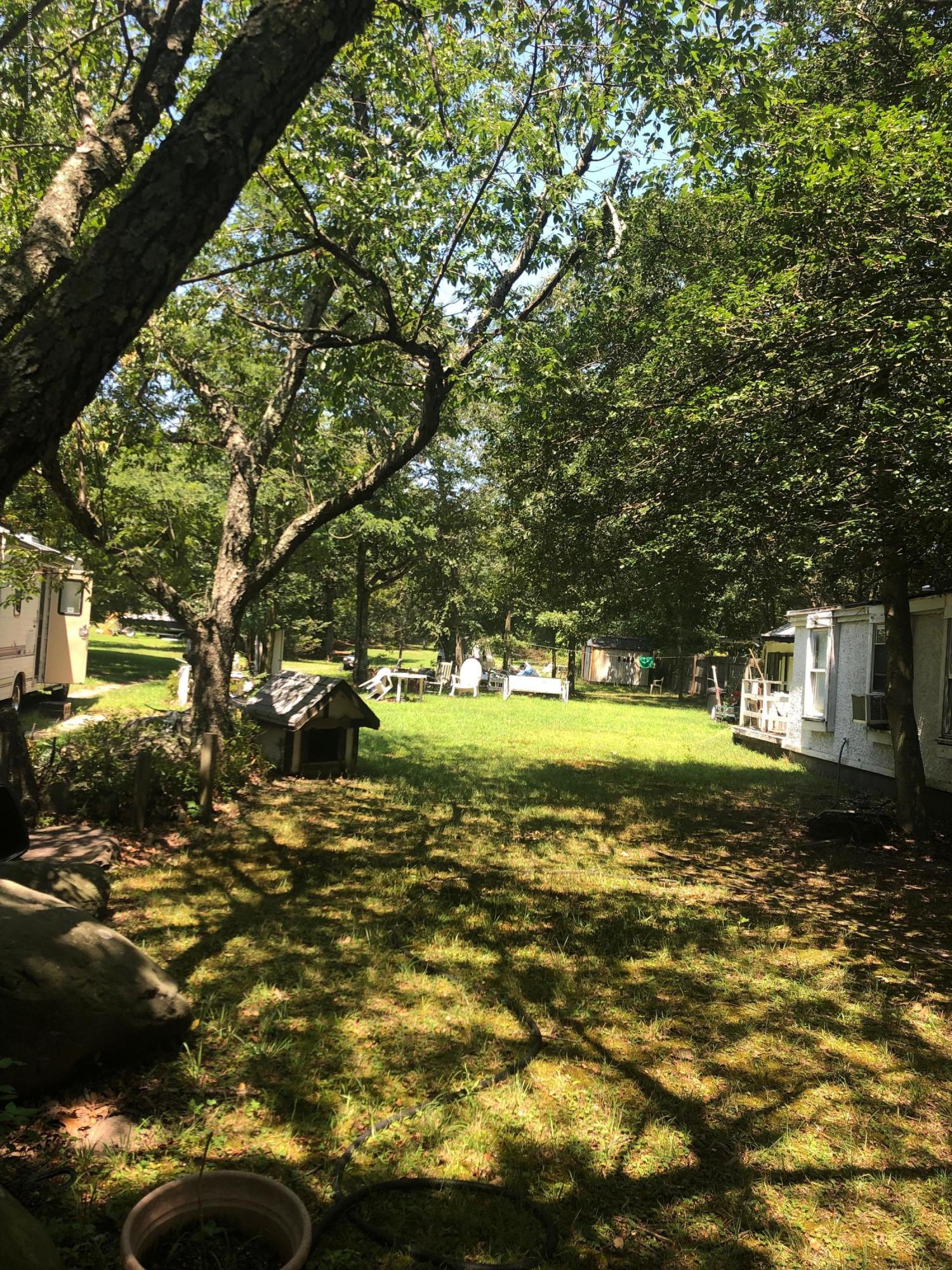 260 Kent Road Howell, NJ 07731 - Photo 3 of 4 a view of a yard with a tree
