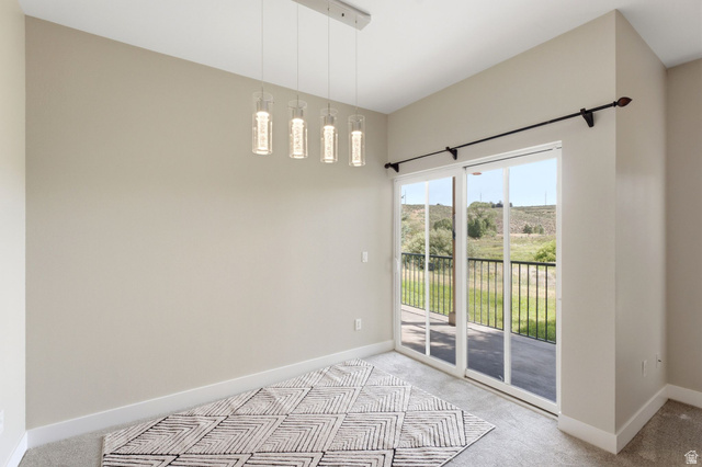 900 Bitner Road, Unit P17 Park City, UT 84098 - Photo 4 of 45 Sliding glass door opening to an outdoor area with a metal railing
