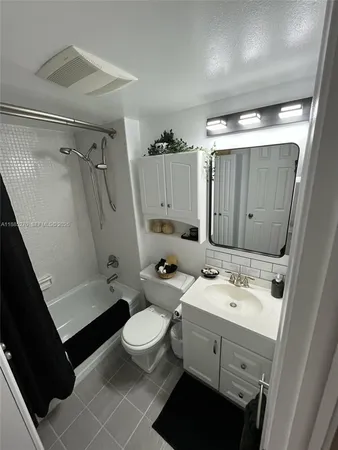 a bedroom with a bed and a tub