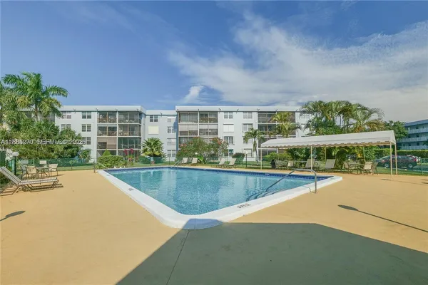 a view of a swimming pool with a lounge chairs