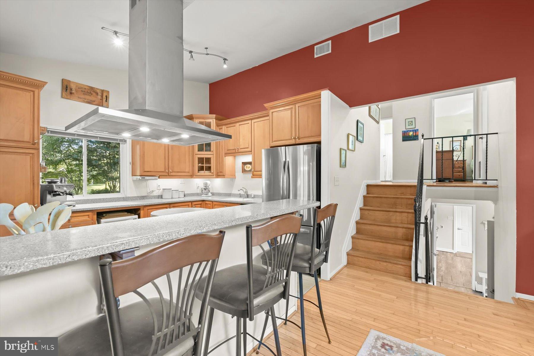 9233 Spring Valley Road Ellicott City, MD 21043 - Photo 13 of 45 a kitchen with stainless steel appliances granite countertop table chairs and a large window