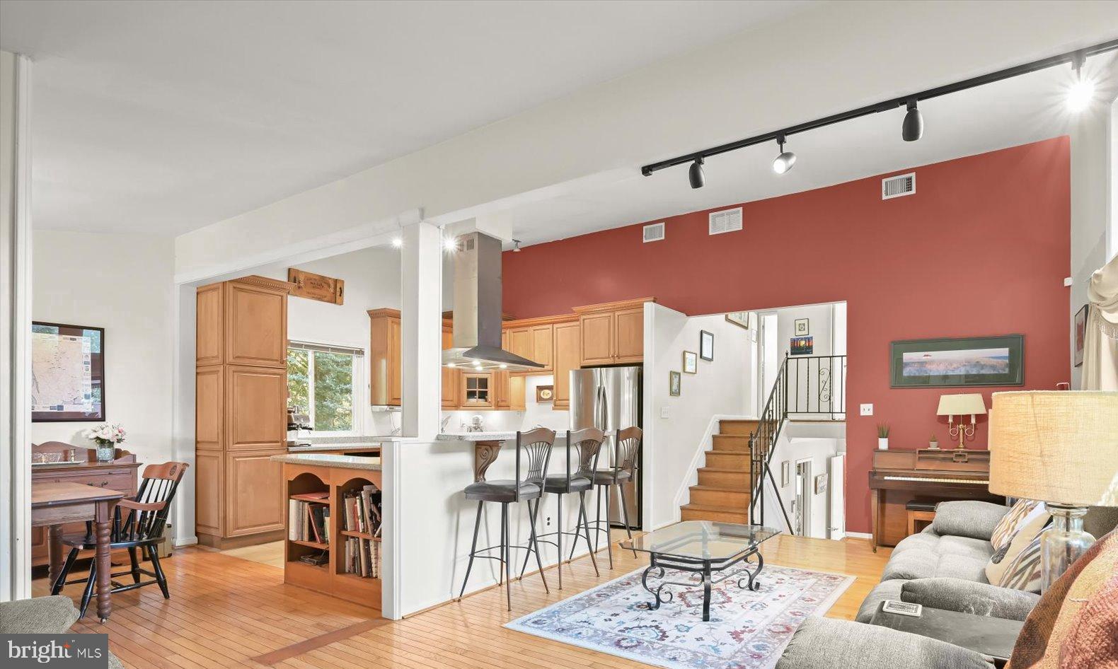 9233 Spring Valley Road Ellicott City, MD 21043 - Photo 14 of 45 a living room with furniture and a floor to ceiling window