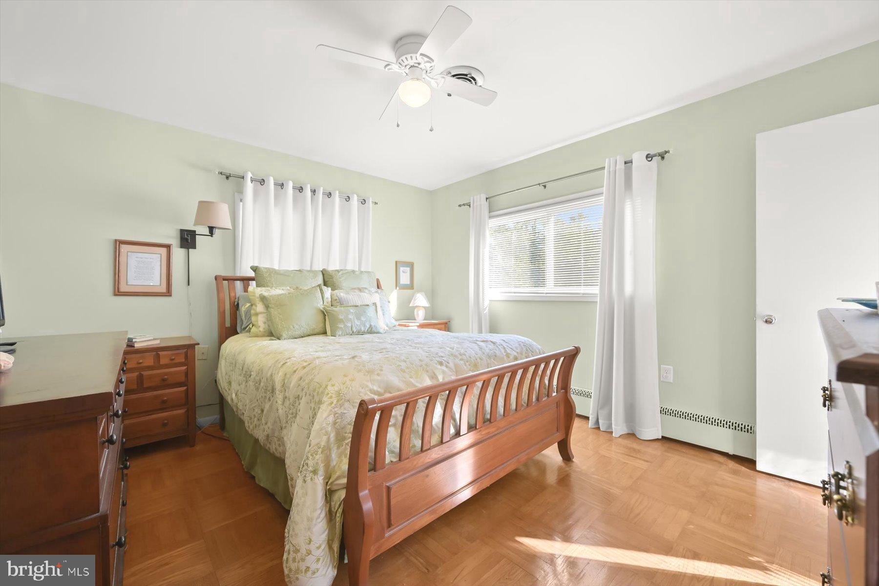 9233 Spring Valley Road Ellicott City, MD 21043 - Photo 17 of 45 a bed sitting in a bedroom next to a window